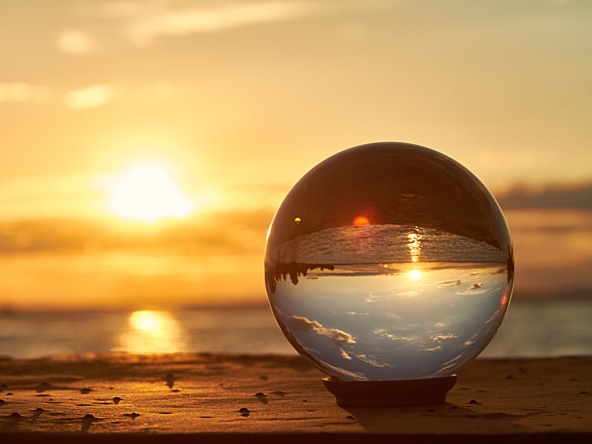 crystal ball with a sunset in the background